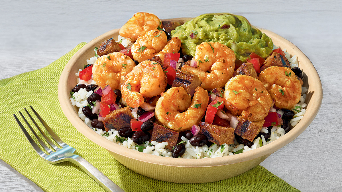 QDOBA Citrus Lime Shrimp bowl with sautéed shrimp, cilantro-lime rice, black beans, pico de gallo, and fresh guacamole